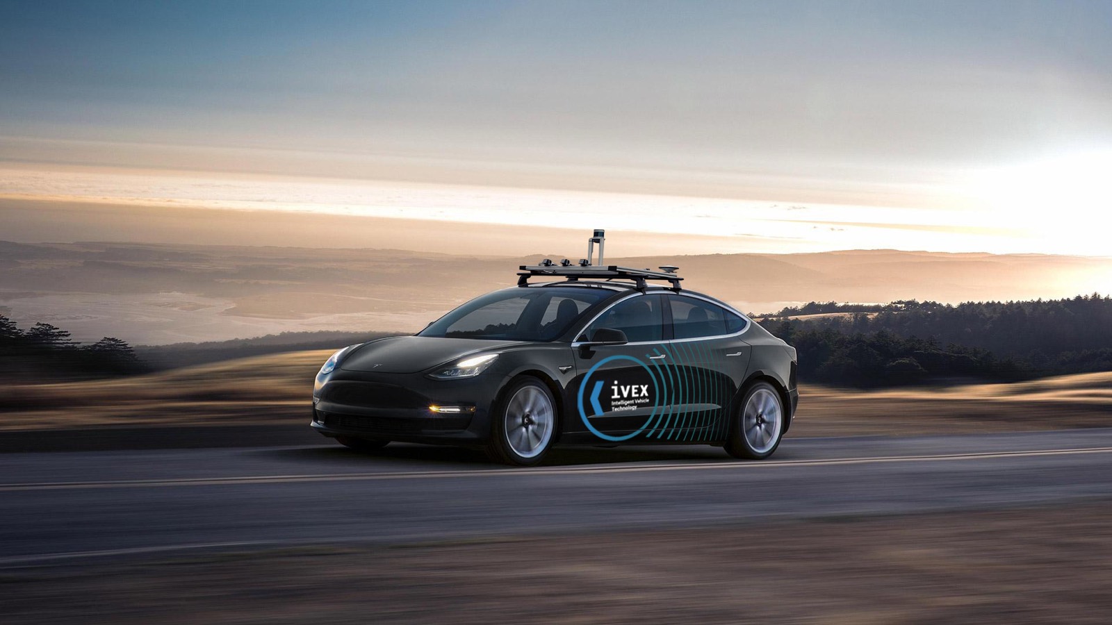 IVEX sensor-equipped autonomous test vehicle driving at sunset
